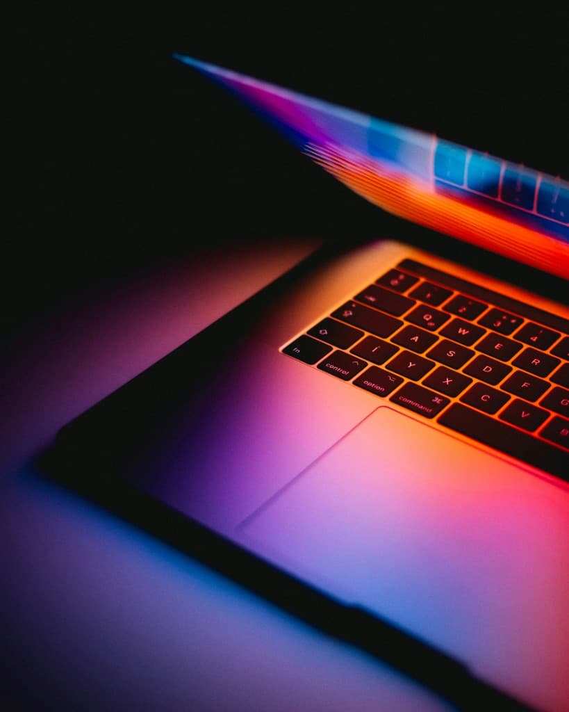 Colorfully lit laptop representing modern web development