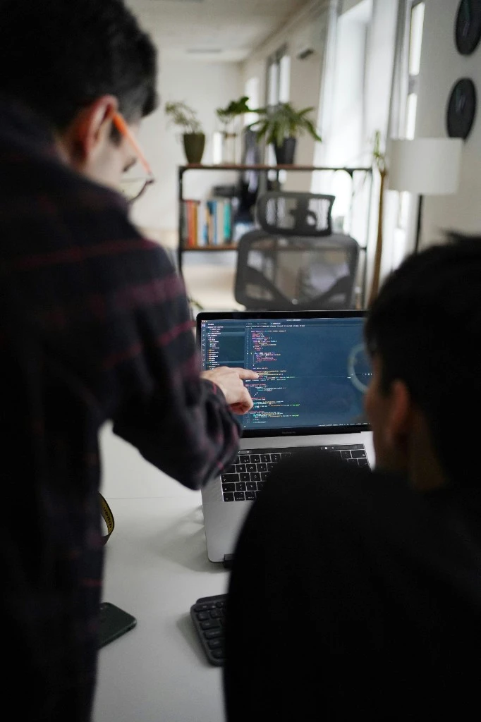 Two developers collaborating over code